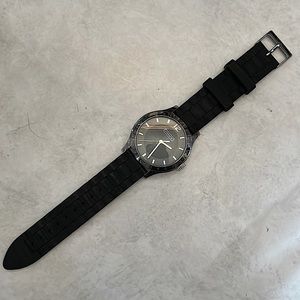 NEEDS BATTERY! Coach watch w/ black rubber band and silver accents. No scratches